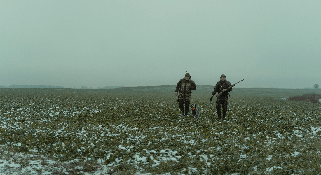 Picture of two hunters on a field
